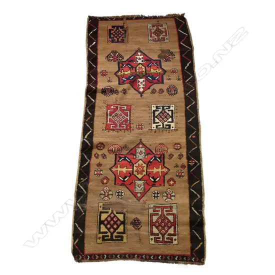 An antique Serab Persian wool and camel hair rug