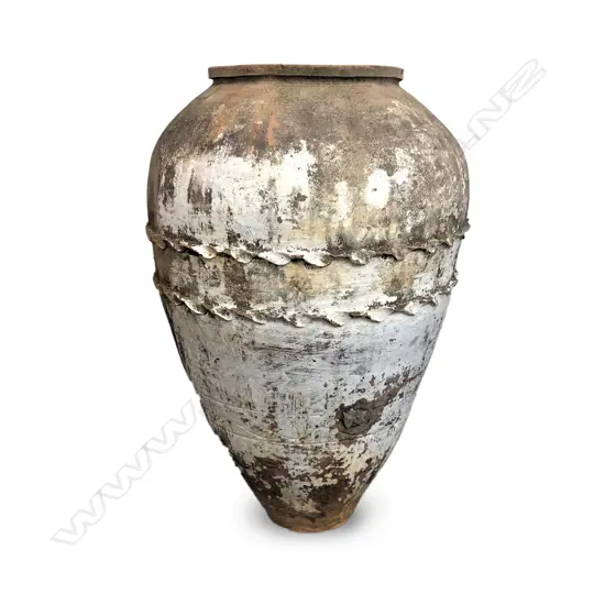 An old European terracotta tall olive oil storage jar