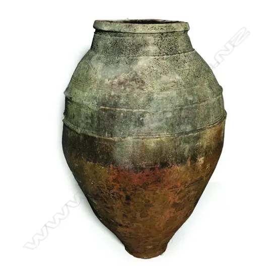 An old European terracotta tall olive oil storage jar