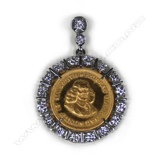 A gold coin and diamond pendant