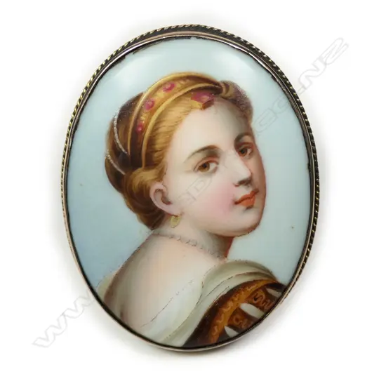 A c1900 9ct rose gold mounted finely painted portrait brooch