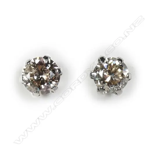A pair of platinum and diamond stud earrings
