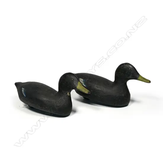 A pair of carved and painted duck decoys