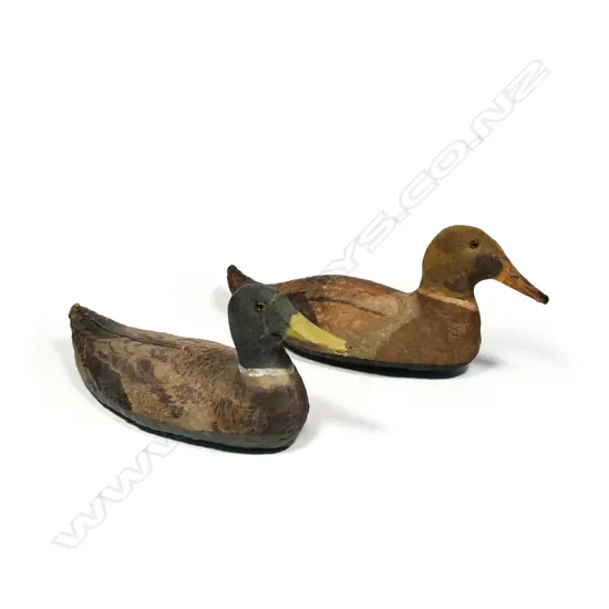 A pair of 16" fine weave leather oil skin duck decoys