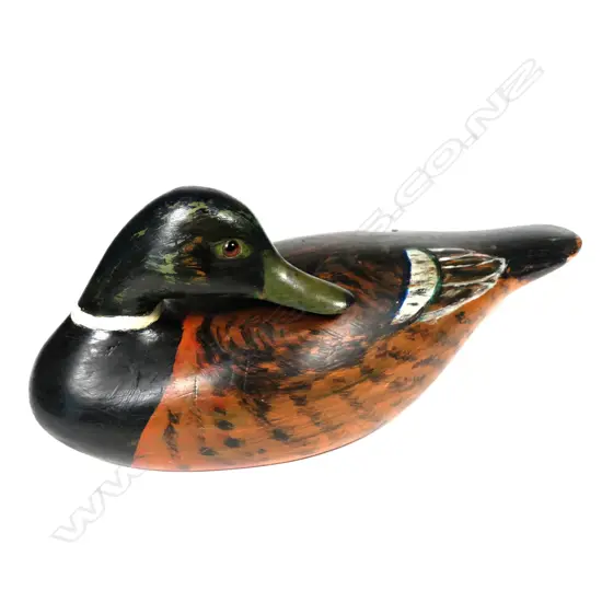A 13" carved cedar preening duck decoy