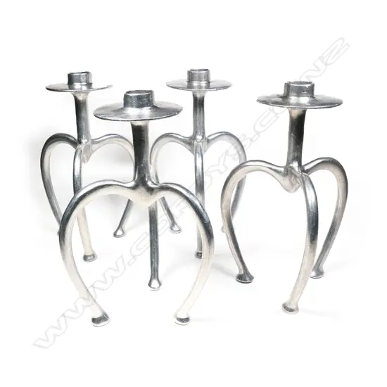Four Stephan Rondel cast aluminium candlesticks