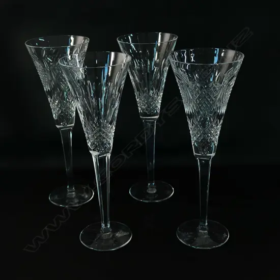 Four Waterford crystal champagne flutes