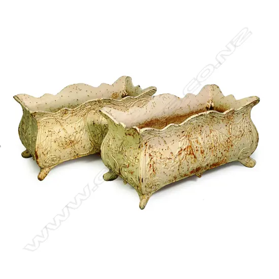 A pair of cast iron garden planters