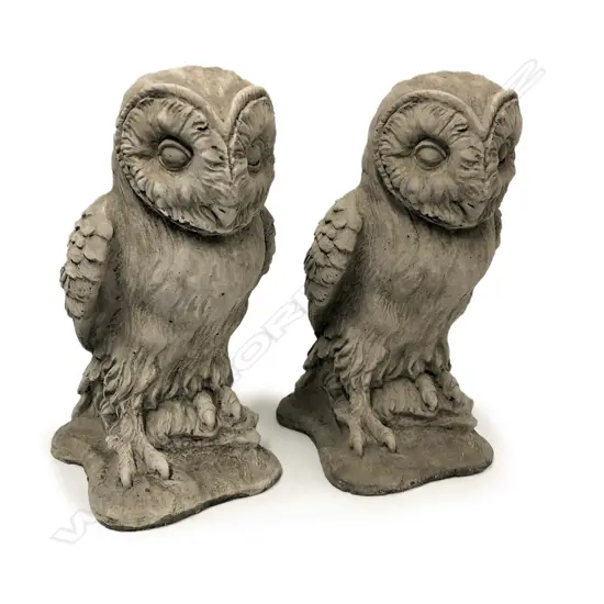 A pair of finely cast concrete owl garden sculptures