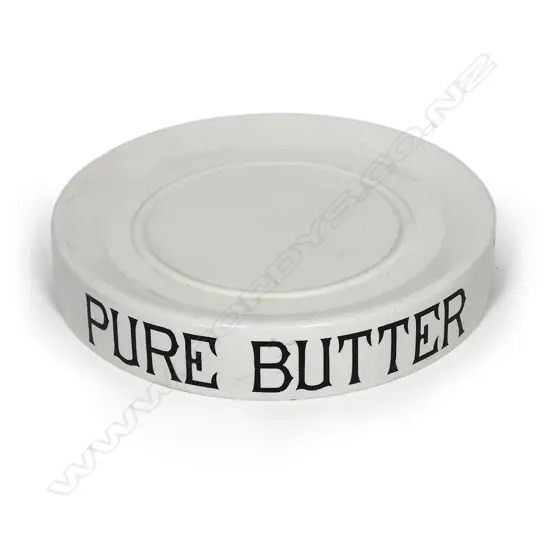 An early 20thC grocery shop display stand 'PURE BUTTER', glazed porcelain, circular slightly dished with carrying handles/cut outs. Dia.320mm