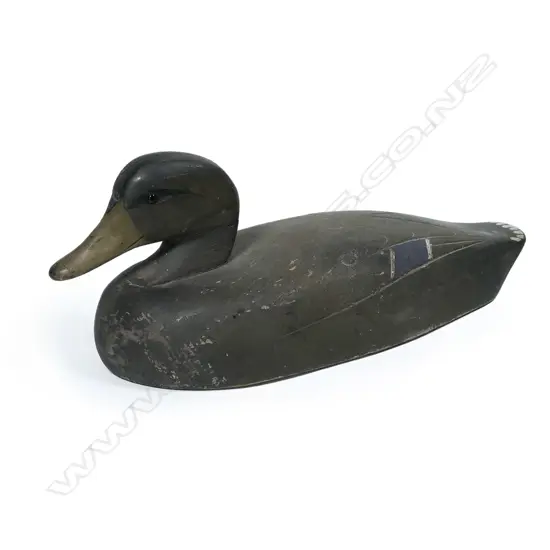A vintage wooden decoy duck,