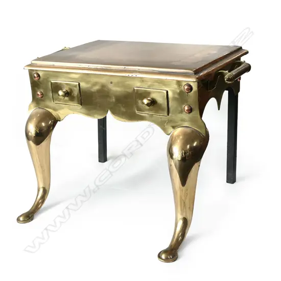 A substantial Victorian brass trivet/footman,