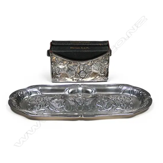 An Edwardian silver and leather prayer book holder,