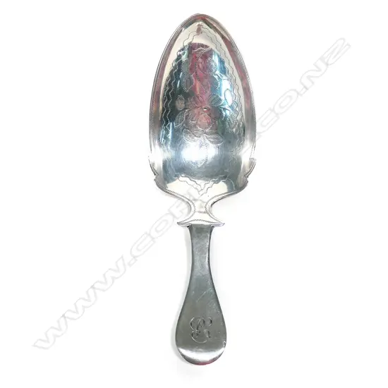 A large silver caddy spoon,