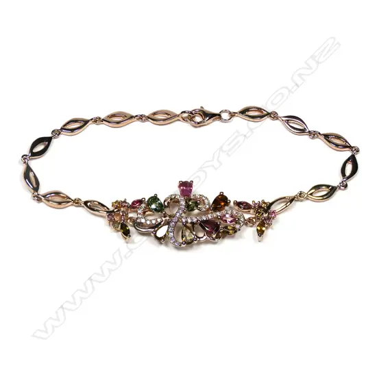 An 18ct rose gold diamond and tourmaline bracelet,