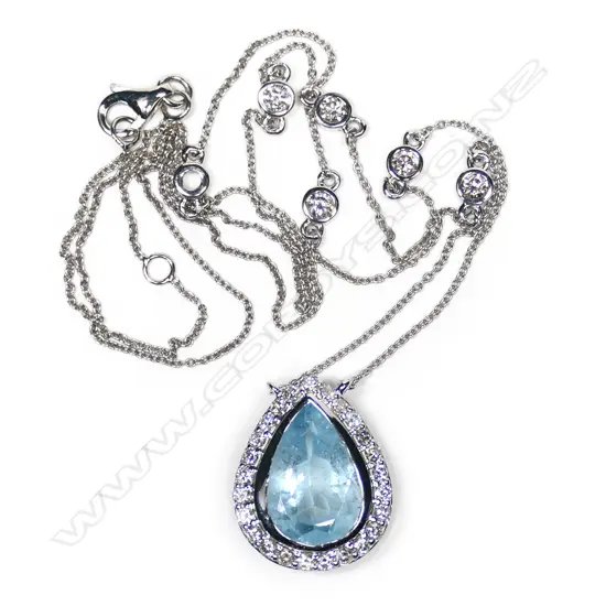 A 14ct white gold, aquamarine and diamond halo necklace,
