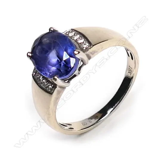 An 18ct white gold, tanzanite and diamond ring,