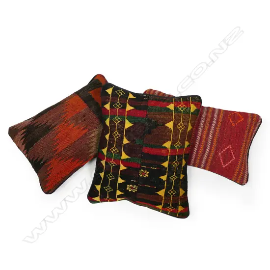 Three Persian scatter cushions,