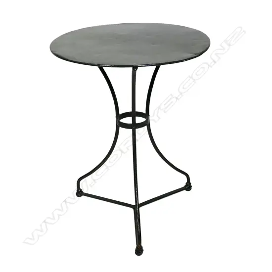 A vintage French wrought iron cafe table,