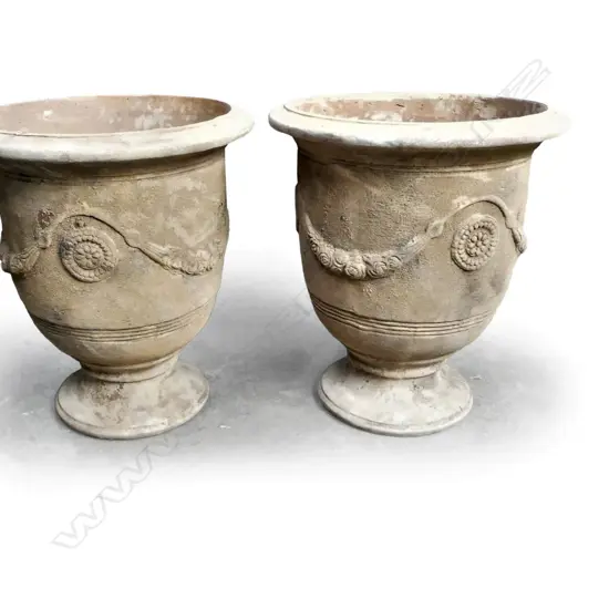 A pair of large classical terracotta garden urns,