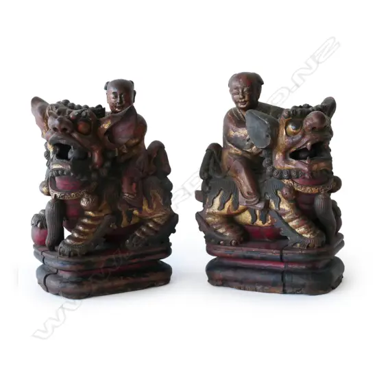 A pair of Chinese carved wooden temple dogs,