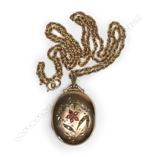 An Edwardian 9ct rose gold gem set locket on chain,