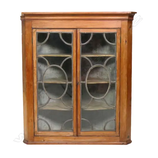 An unusual handing corner cabinet