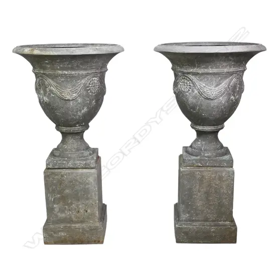 A pair of French style ‘Stonecast’ garden urns,