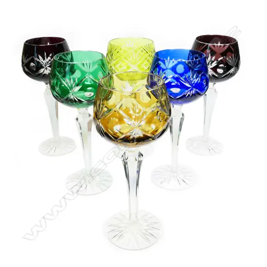 A harlequin set of six Bohemian wine glasses.
