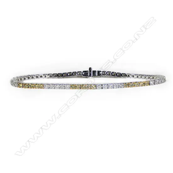 A 14ct white gold and fancy yellow diamond tennis bracelet,