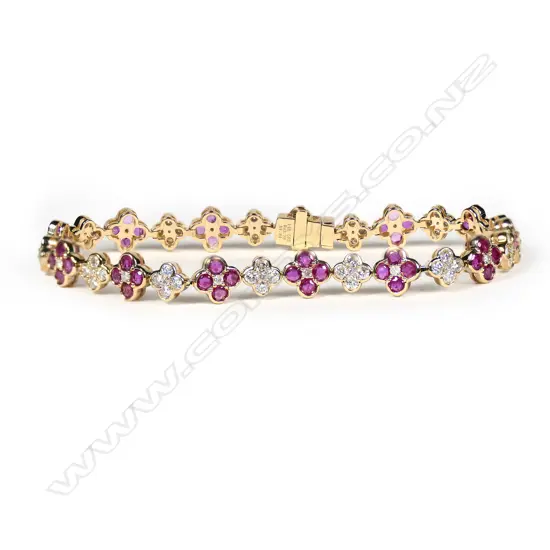 A 14ct gold, ruby and diamond floral design bracelet,