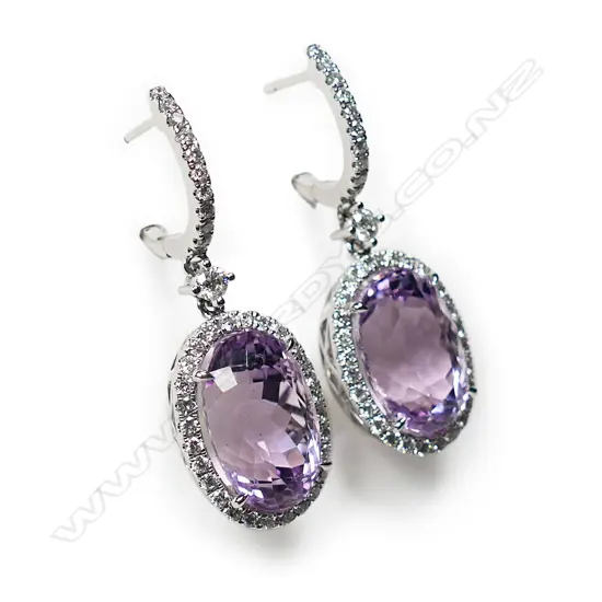 A pair of 14ct white gold, kunzite and diamond halo drop earrings,