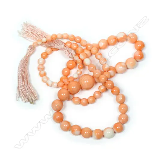 A vintage pink coral bead sautoir,