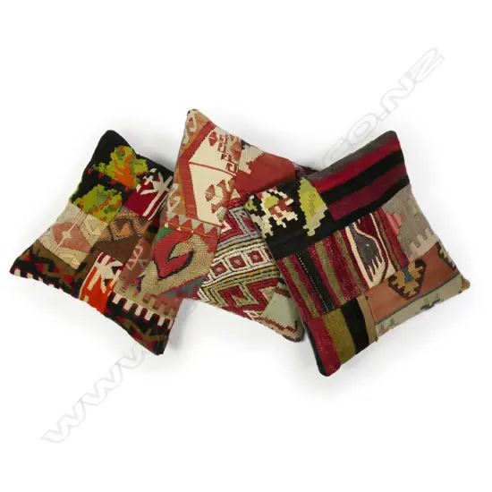Three scatter cushions with slit weft kilim faces,