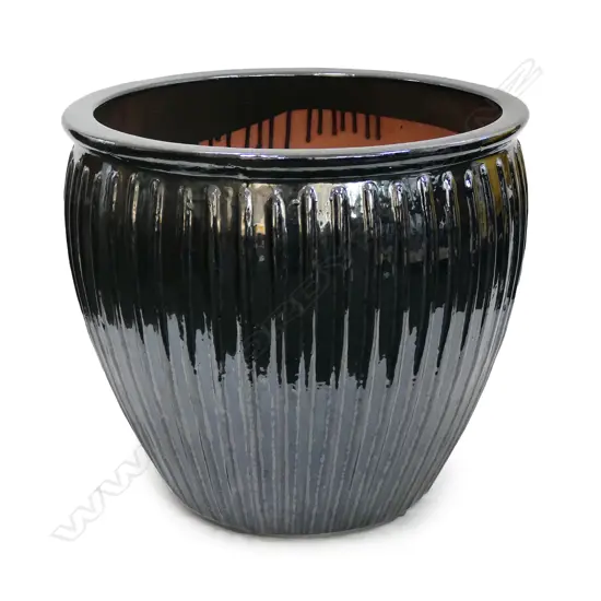 A large black glazed garden pot,