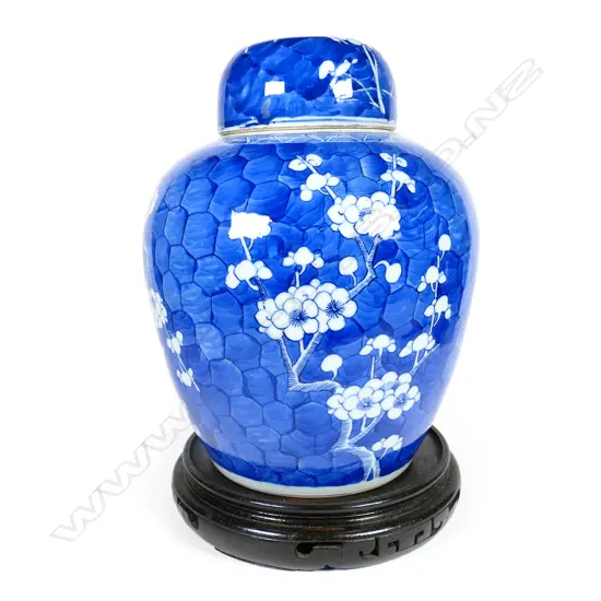 A large 19thC Chinese porcelain ginger jar on wooden stand