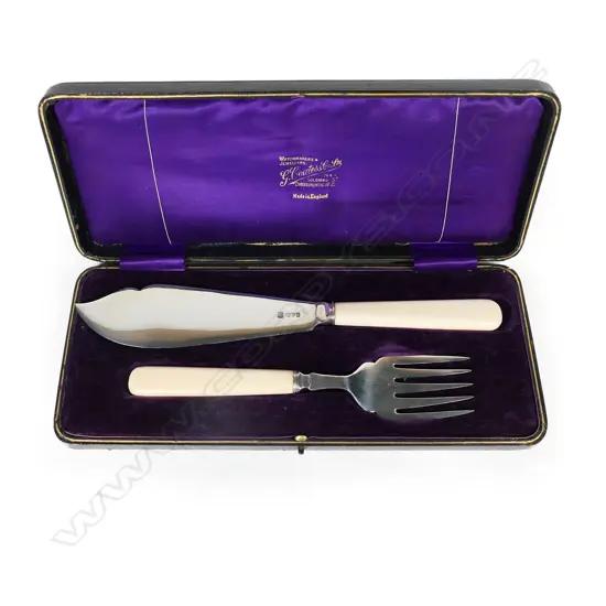 A pair of silver and ivory handled fish servers,