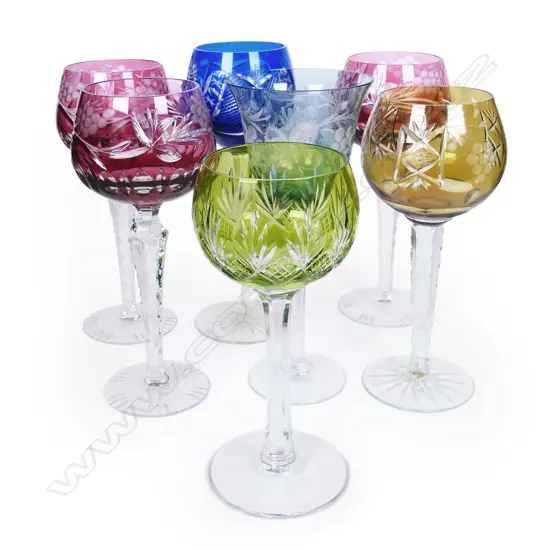 A harlequin set of seven Bohemian wine glasses.