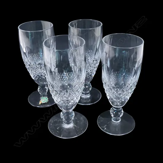 A set of four Waterford crystal champagne flutes,