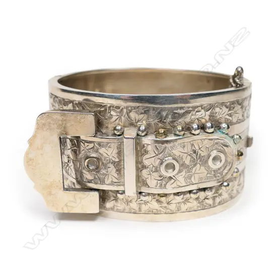 An Edwardian silver fancy buckle form hinged bangle,
