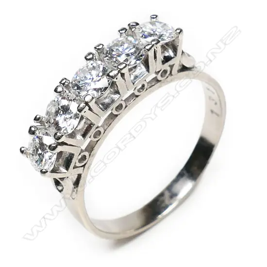 A 14ct white gold and five stone diamond bridge ring,