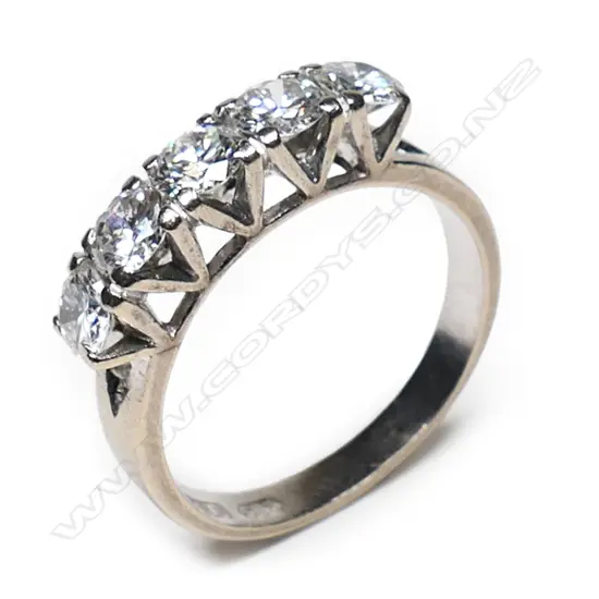A 14ct white gold and five diamond bridge ring,