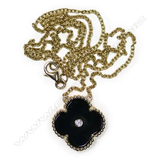 An 18ct gold, onyx and diamond Van Cleef inspired pendant necklace,