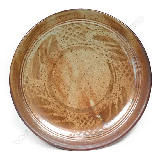 A Peter Stichbury wax resist lustrous shino glazed plate,