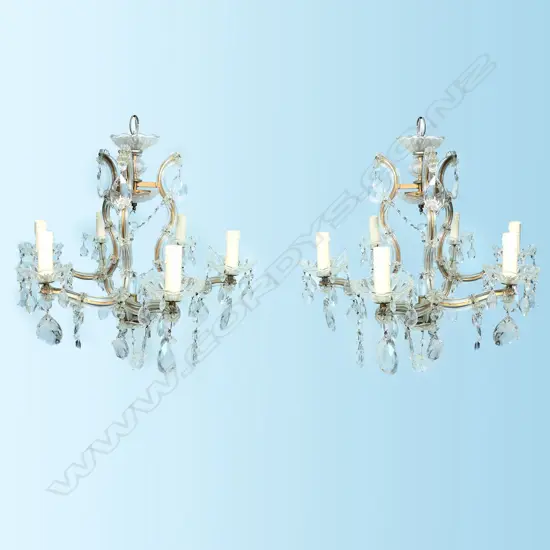 A pair of cut glass six-branch chandeliers,