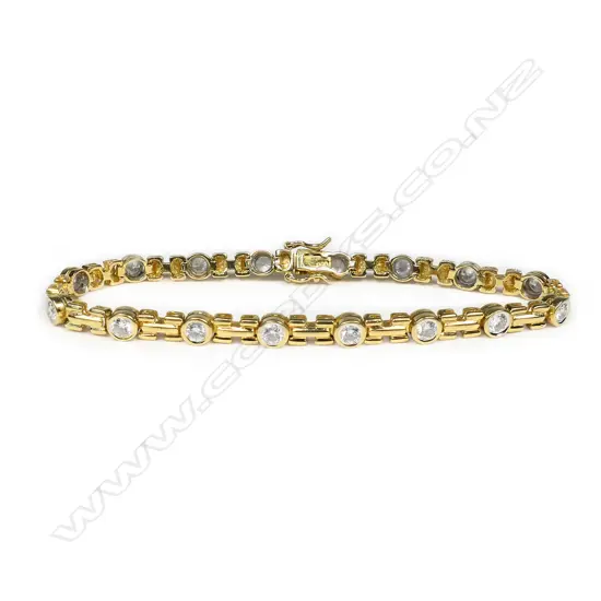 An 18ct yellow gold and 16 diamond set bracelet,