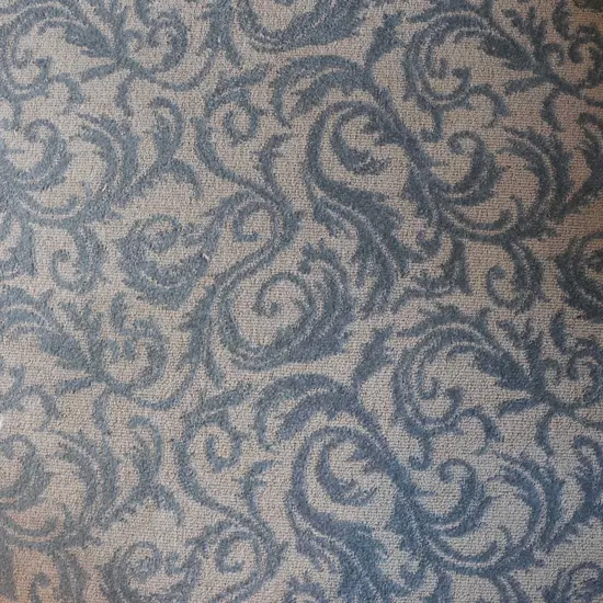 A Large ornately patterned blue and grey artisan carpet -some marks 3950 x 3600mm