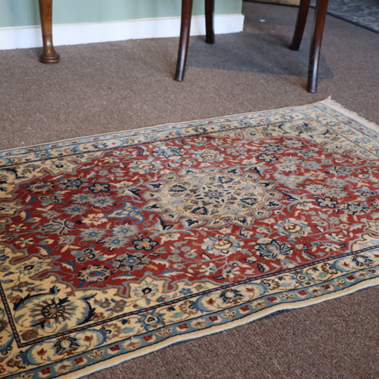 A small vintage silk Persian rug,