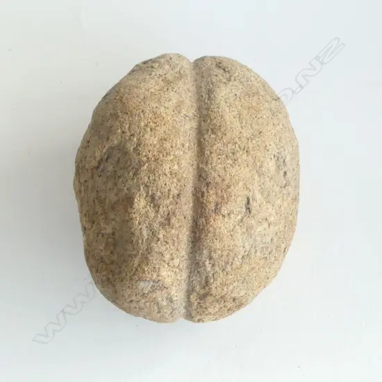 An old Māori stone mahe (sinker) with latitudinal lashing groove,