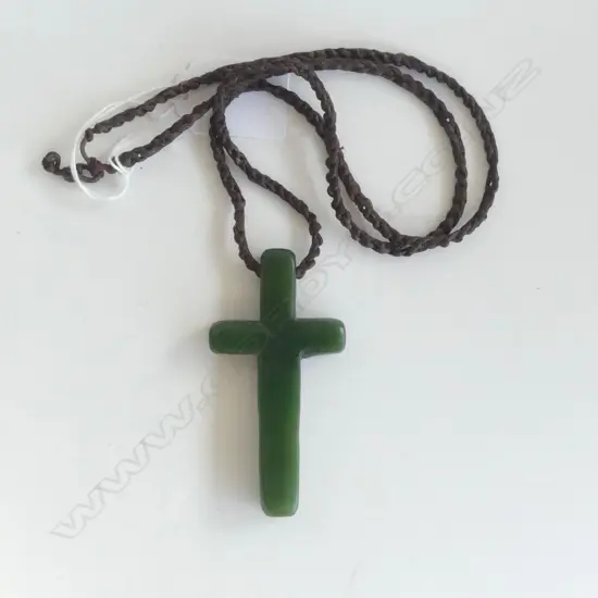 A pounamu carved cross pendant